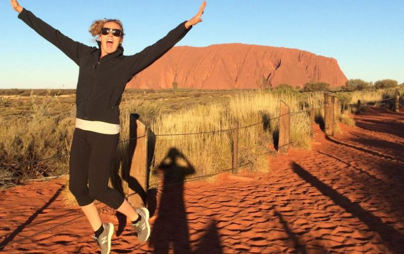 A pair of hands framing the view of Uluru in Australia on a 3 day UIluru Adventure