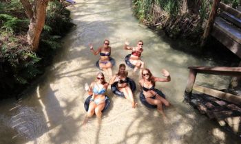 Eli Creek K'gari Fraser IslandBackpackers on a Dingo's K'Gari Fraser Island trip floating down the Eli Creek fresh water spring on inflatable tubes
