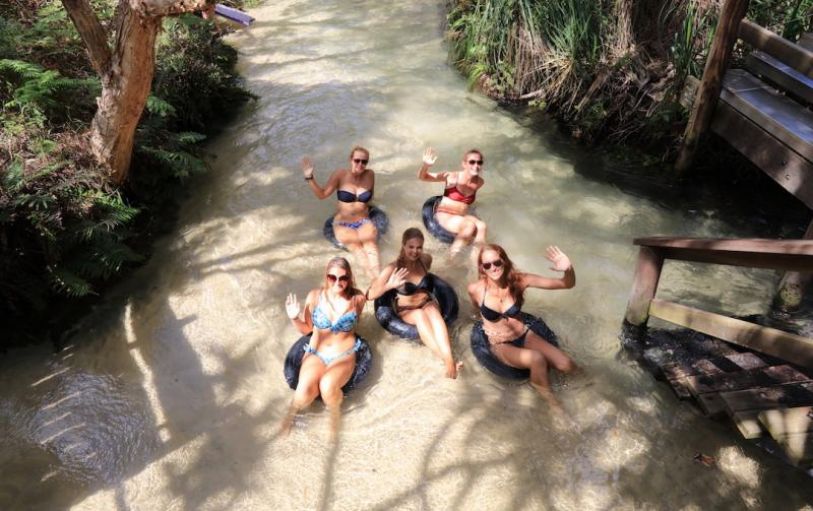 Eli Creek K'gari Fraser IslandBackpackers on a Dingo's K'Gari Fraser Island trip floating down the Eli Creek fresh water spring on inflatable tubes
