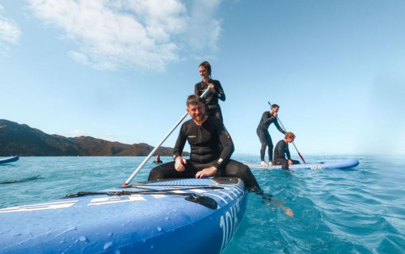 A backpacker swimming in The White sundays Australia