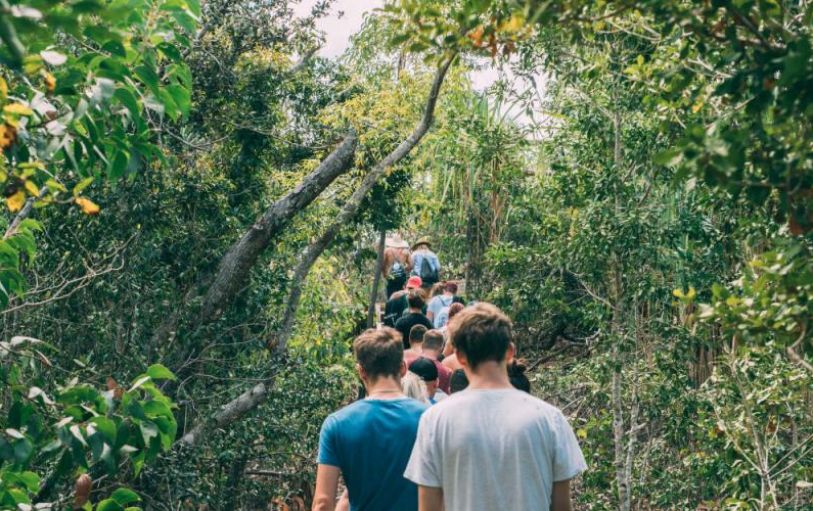 A backpacker swimming in The White sundays Australia