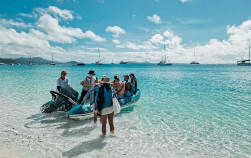 A backpacker swimming in The White sundays Australia
