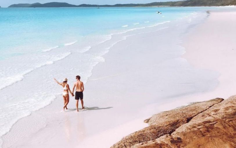 A backpacker swimming in The White sundays Australia