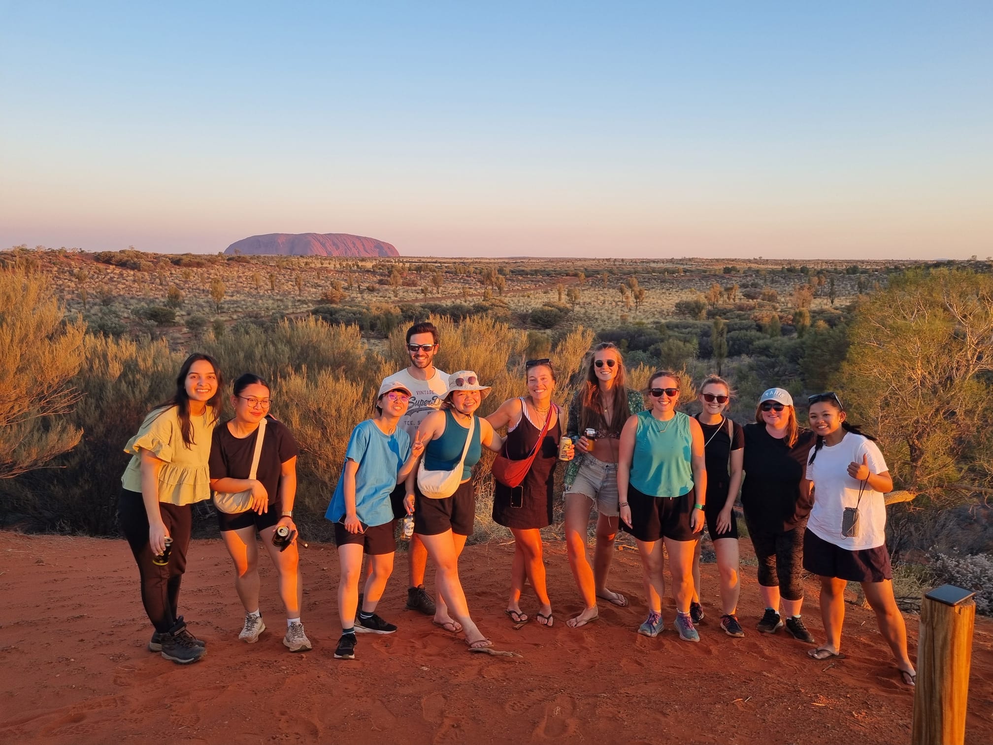 Friends at Uluru at sunset on the Rock The Centre Tour