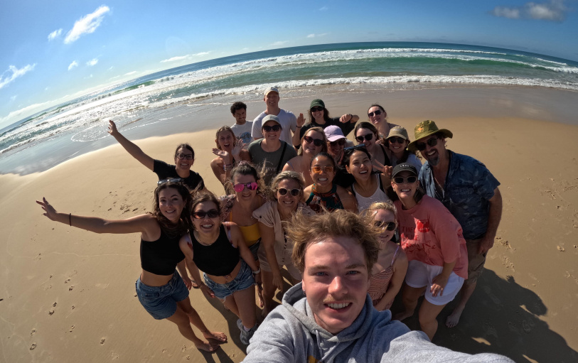 2 backpacker girls sitting in glass pool in Noosa