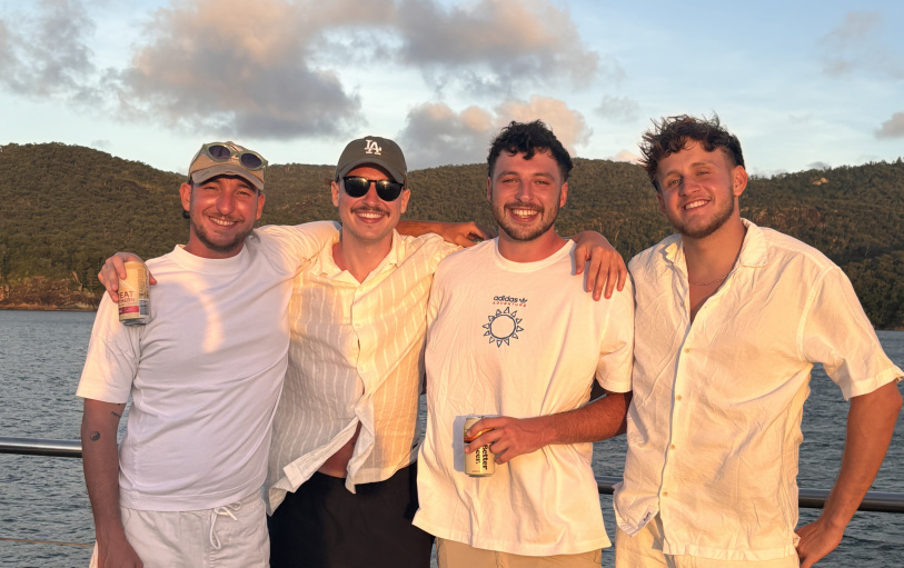 2 backpacker girls sitting in glass pool in Noosa