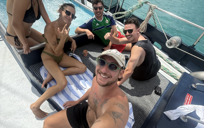 2 backpacker girls sitting in glass pool in Noosa