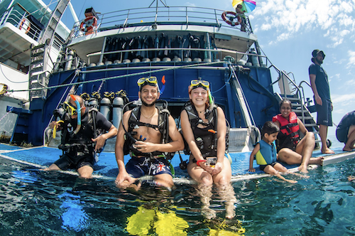 Two scuba divers on the back of the Reef Experience day trip on the Great Barrier Reef