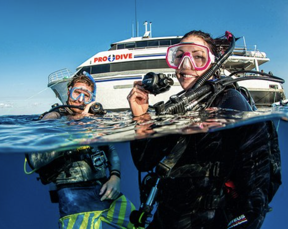 Two divers in the water ready to go scuba diving on the prodive scuba liveaboard 