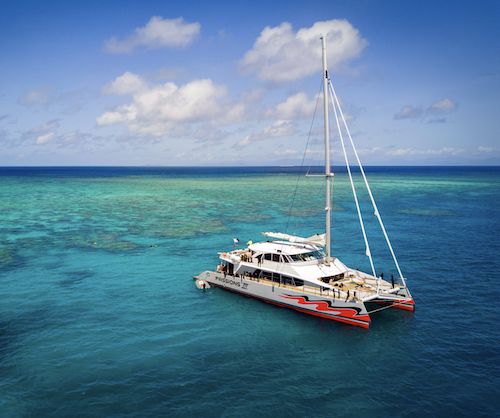 The passions of paradise boat moored up at the Great Barrier Reef during a scuba diving and snorkelling day trip